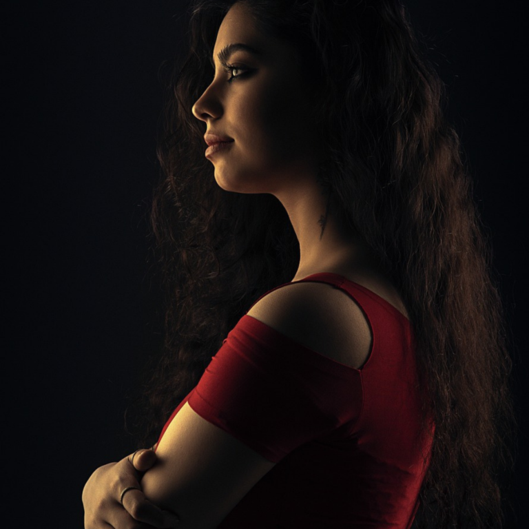 Studio portrait of a lady, side view