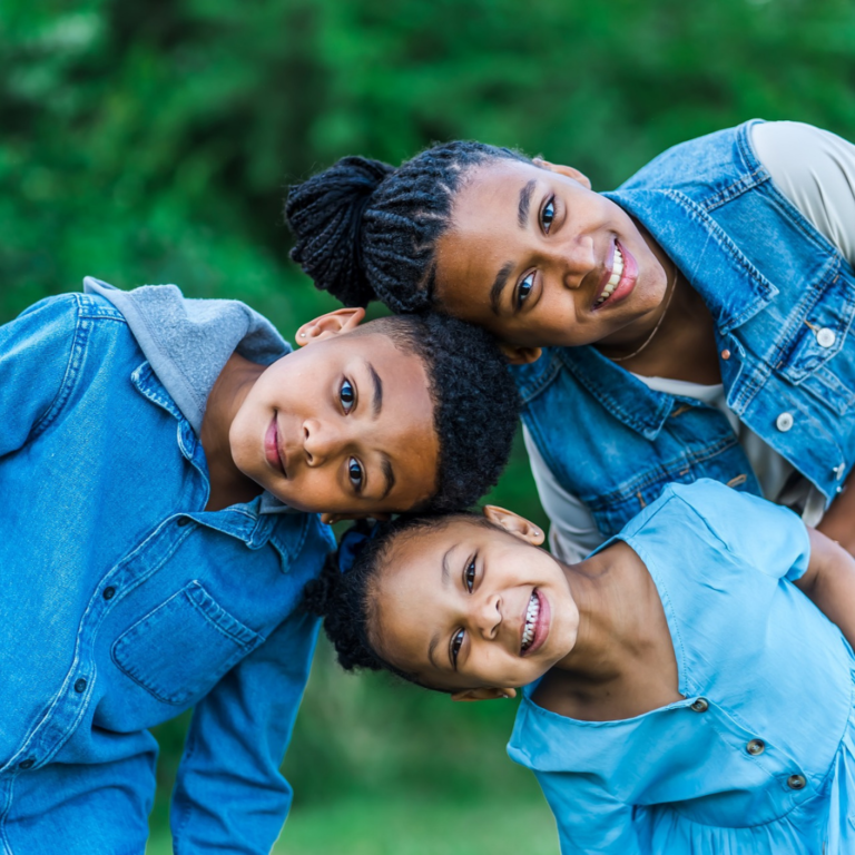 Outdoor photoshoot for a family of three, mother, boy, and girl