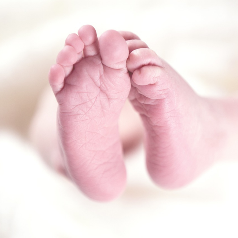 Baby photoshoot showing the infant's little feet