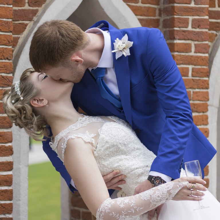 Romantic Wedding Couple celebrating their wedding with a kiss